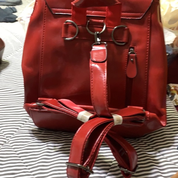 New red leather backpack with silver hardware. Never used. - Picture 2 of 2